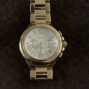 Michael Kors gold watch.